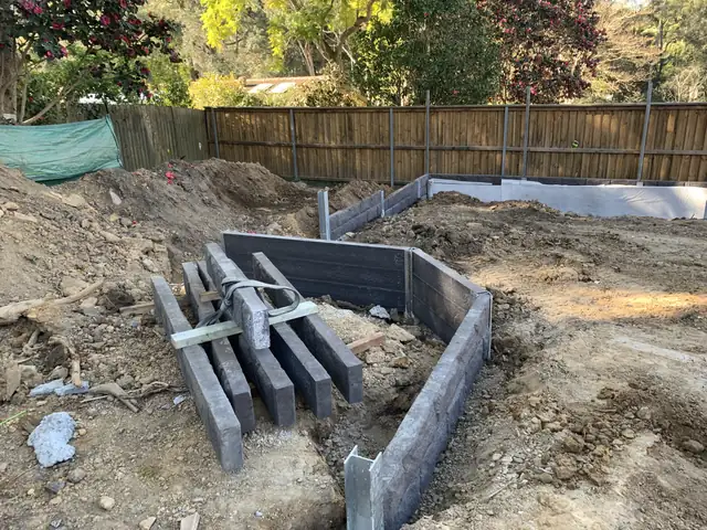 Concrete sleepers and steel posts on site ready for installation